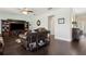 Well-lit living room with hardwood floors, a ceiling fan, and a built-in entertainment center at 2842 Balforn Tower, Winter Garden, FL 34787