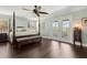 Spacious main bedroom featuring a four-poster bed and private access to the patio at 2842 Balforn Tower, Winter Garden, FL 34787