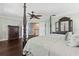 Beautifully decorated main bedroom with a four-poster bed, dresser, and ample space at 2842 Balforn Tower, Winter Garden, FL 34787