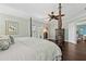 Cozy main bedroom with stylish furnishings, a four-poster bed, and patio access at 2842 Balforn Tower, Winter Garden, FL 34787