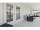 Relaxing screened patio with French doors and outdoor seating area at 2842 Balforn Tower, Winter Garden, FL 34787