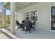 Covered outdoor patio with a dining table, chairs, and view of the yard at 2842 Balforn Tower, Winter Garden, FL 34787