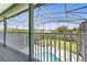 Enjoy the view from this screened-in patio overlooking the pool and lush backyard at 2842 Balforn Tower, Winter Garden, FL 34787
