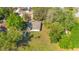 A lovely single-Gathering home with a lush backyard, tall trees, and a white fence at 2927 Ahern Dr, Orlando, FL 32817