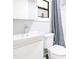 Clean, well-lit bathroom with a white vanity, toilet, and shower with a gray curtain at 2927 Ahern Dr, Orlando, FL 32817