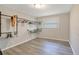 Minimalist bedroom design with industrial-style clothing racks, a window, and light floors at 2927 Ahern Dr, Orlando, FL 32817