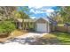 Charming single-story home with attached garage and well-manicured lawn at 2927 Ahern Dr, Orlando, FL 32817