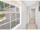 Bright hallway with natural light from window and light wood floors at 2927 Ahern Dr, Orlando, FL 32817