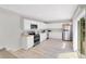 Updated kitchen features white cabinets, stainless steel appliances, and recessed lighting at 2927 Ahern Dr, Orlando, FL 32817