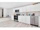 Well-lit kitchen with stainless steel appliances, modern cabinetry, and stylish backsplash at 2927 Ahern Dr, Orlando, FL 32817