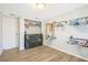 Laundry room featuring modern washer and dryer, light floors, and industrial-style clothes rack at 2927 Ahern Dr, Orlando, FL 32817