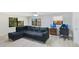 Spacious living room featuring a plush sectional and ample natural light at 2927 Ahern Dr, Orlando, FL 32817