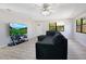Cozy living room with sleek sectional couch and bright sunlight at 2927 Ahern Dr, Orlando, FL 32817