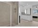 Bathroom showcasing a glass enclosed shower, granite vanity, and access to the main bedroom at 3017 Ambersweet Pl, Clermont, FL 34711