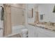 Bright bathroom featuring a shower-tub combo and granite vanity at 3017 Ambersweet Pl, Clermont, FL 34711
