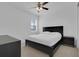 Bedroom featuring a ceiling fan, carpeted floor and a window at 3017 Ambersweet Pl, Clermont, FL 34711