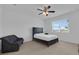 Bedroom featuring a ceiling fan, carpeted floor and a window at 3017 Ambersweet Pl, Clermont, FL 34711