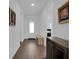 Entryway featuring wood flooring and modern decor at 3017 Ambersweet Pl, Clermont, FL 34711