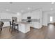 Open kitchen showcasing a spacious layout, granite countertops, and stainless steel appliances at 3017 Ambersweet Pl, Clermont, FL 34711