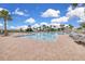 Luxurious pool area surrounded by lounge chairs and mature landscaping at 3017 Ambersweet Pl, Clermont, FL 34711