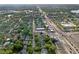 A high, wide aerial shot showcasing neighborhood and city beyond at 318 E Jersey St, Orlando, FL 32806