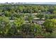 An aerial view showcasing the neighborhood and proximity to the Tampa skyline in the background at 318 E Jersey St, Orlando, FL 32806
