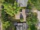 Aerial view of the house showing the roof, surrounding greenery, and neighbor properties at 318 E Jersey St, Orlando, FL 32806