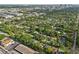 A sprawling aerial shot featuring a neighborhood, trees, and the Tampa skyline at 318 E Jersey St, Orlando, FL 32806