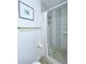 Bathroom showing a shower with decorative tiles, a rainfall showerhead and brass hardware at 318 E Jersey St, Orlando, FL 32806