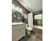 Stylish bathroom with slate stone-style flooring and a shower-tub combo at 318 E Jersey St, Orlando, FL 32806