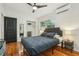 Inviting bedroom with ample natural light, closet, and hardwood floors, perfect for relaxation and comfort at 318 E Jersey St, Orlando, FL 32806