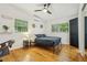Bright bedroom with natural light, hardwood floors, closet, and relaxing atmosphere, perfect for a restful night's sleep at 318 E Jersey St, Orlando, FL 32806