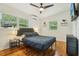 Inviting bedroom featuring natural light, hardwood floors, and ample space for relaxation and rest at 318 E Jersey St, Orlando, FL 32806