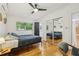 Bright bedroom with hardwood floors, natural light, and closet, perfect for a peaceful night's rest at 318 E Jersey St, Orlando, FL 32806