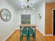 Dining area featuring modern lighting, with great natural light and hardwood floors at 318 E Jersey St, Orlando, FL 32806