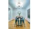 Bright dining room features new lighting, ample natural light, and hardwood floors at 318 E Jersey St, Orlando, FL 32806