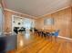 The dining area displays an open layout with wood paneling, hardwood floors, and modern decor throughout at 318 E Jersey St, Orlando, FL 32806