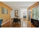 Dining room with wood paneling, wood floors and rustic dining table at 318 E Jersey St, Orlando, FL 32806