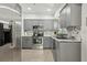 Kitchen featuring stainless steel appliances and gray cabinets at 318 E Jersey St, Orlando, FL 32806