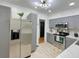 The kitchen showcases modern gray cabinets, stainless steel appliances, and contemporary lighting at 318 E Jersey St, Orlando, FL 32806