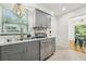 Kitchen featuring stainless dishwasher and view into breakfast nook at 318 E Jersey St, Orlando, FL 32806
