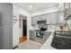 Kitchen featuring gray cabinets and a view into another room at 318 E Jersey St, Orlando, FL 32806