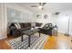 Cozy living room showcasing a plush sectional sofa, decorative pillows, and a stylish area rug at 318 E Jersey St, Orlando, FL 32806