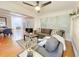 Bright living room featuring hardwood floors, neutral paint, modern furnishings, and a ceiling fan at 318 E Jersey St, Orlando, FL 32806