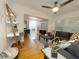 Inviting living room leading into the dining area with hardwood floors and natural light at 318 E Jersey St, Orlando, FL 32806