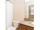 This bathroom has a neutral color scheme with a shower and vanity with a stone-look countertop at 3643 Calabria Avenue, Davenport, FL 33897