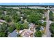 The aerial view highlights the home's location in a beautiful neighborhood with mature trees at 3795 Rachel St, Apopka, FL 32703