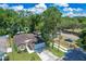 Aerial view showcases a home with a well-manicured lawn and attached two-car garage at 3795 Rachel St, Apopka, FL 32703