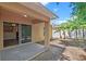 A covered back porch and banana trees are highlights of this charming backyard space at 3795 Rachel St, Apopka, FL 32703