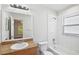 Bright bathroom with a tub and shower combination and wood vanity at 3795 Rachel St, Apopka, FL 32703